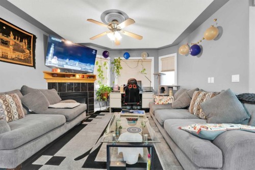 185 Tarawood Place Ne, Calgary, AB - Indoor Photo Showing Living Room With Fireplace