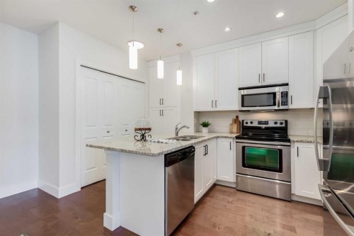 308-1899 45 Street Nw, Calgary, AB - Indoor Photo Showing Kitchen With Stainless Steel Kitchen With Upgraded Kitchen