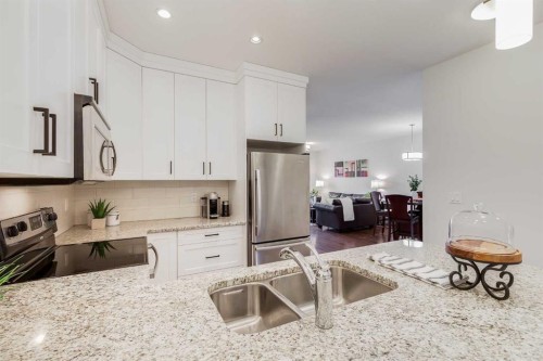 308-1899 45 Street Nw, Calgary, AB - Indoor Photo Showing Kitchen With Stainless Steel Kitchen With Double Sink With Upgraded Kitchen