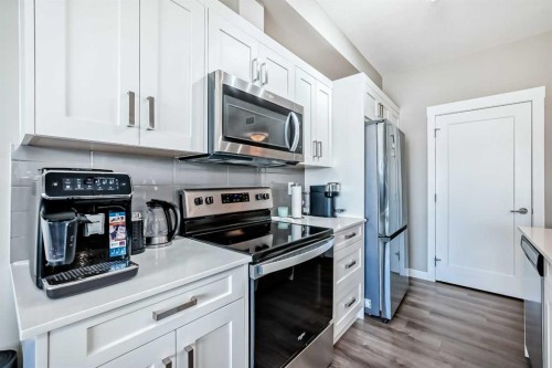 207-40 Walgrove Walk Se, Calgary, AB - Indoor Photo Showing Kitchen With Stainless Steel Kitchen With Upgraded Kitchen