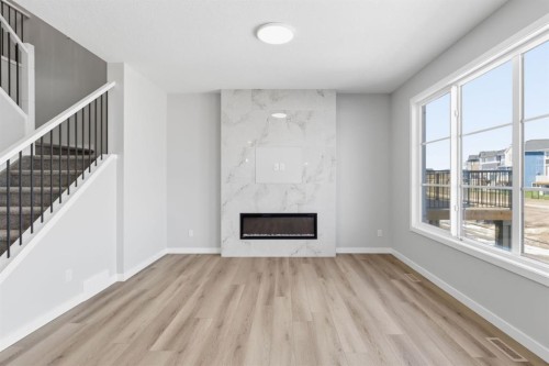 132 Lewiston Drive Ne, Calgary, AB - Indoor With Fireplace