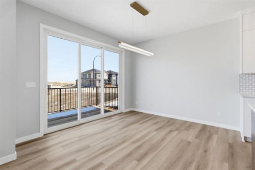 132 Lewiston Drive Ne, Calgary, AB - Indoor Photo Showing Other Room With Fireplace