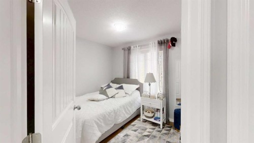 103 Prestwick Villas Se, Calgary, AB - Indoor Photo Showing Bedroom