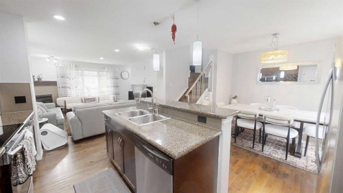 103 Prestwick Villas Se, Calgary, AB - Indoor Photo Showing Kitchen With Double Sink With Upgraded Kitchen