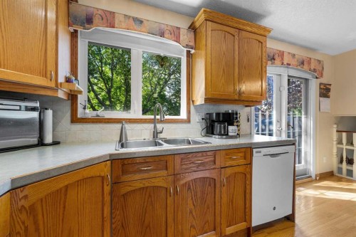 7 Bernard Court Nw, Calgary, AB - Indoor Photo Showing Kitchen With Double Sink