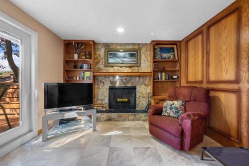 7 Bernard Court Nw, Calgary, AB - Indoor Photo Showing Living Room With Fireplace