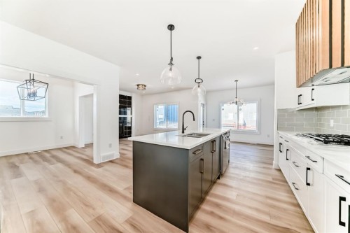708 Mandalay Avenue, Carstairs, AB - Indoor Photo Showing Kitchen With Upgraded Kitchen