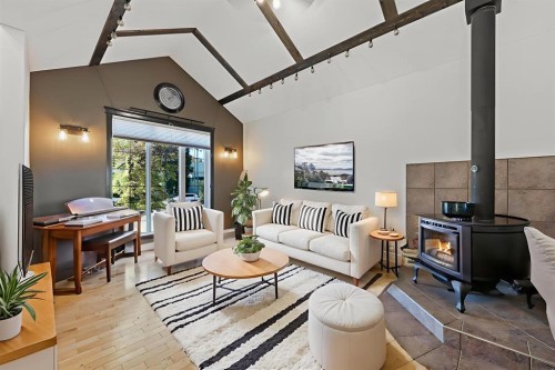 39 Valarosa Drive, Didsbury, AB - Indoor Photo Showing Living Room With Fireplace