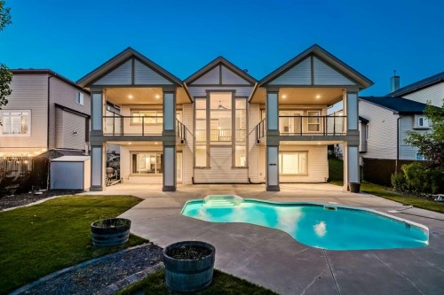 231 Railway Close Se, Langdon, AB - Outdoor With In Ground Pool With Balcony