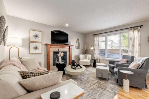 32 Evanscove Heights Nw, Calgary, AB - Indoor Photo Showing Living Room With Fireplace