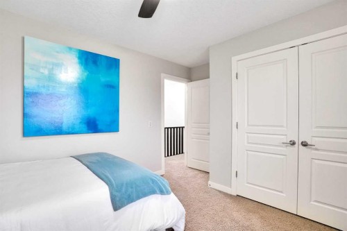142 Luxstone View Sw, Airdrie, AB - Indoor Photo Showing Bedroom