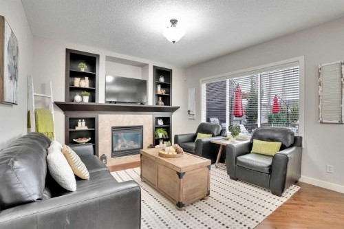 142 Luxstone View Sw, Airdrie, AB - Indoor Photo Showing Living Room With Fireplace