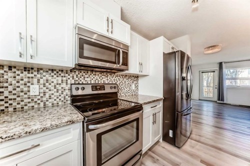 418 Covecreek Circle Ne, Calgary, AB - Indoor Photo Showing Kitchen With Upgraded Kitchen