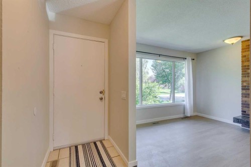 2823 Dover Ridge Drive Se, Calgary, AB - Indoor Photo Showing Other Room With Fireplace
