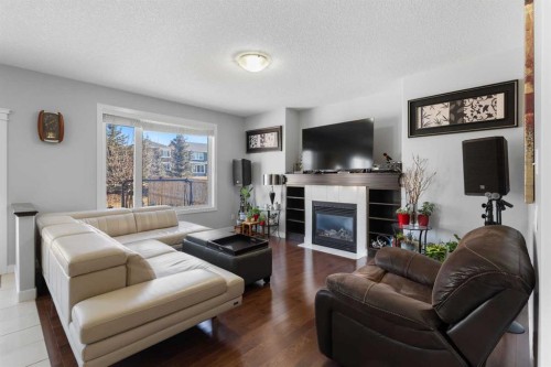 16 Redstone Parade Ne, Calgary, AB - Indoor Photo Showing Living Room With Fireplace