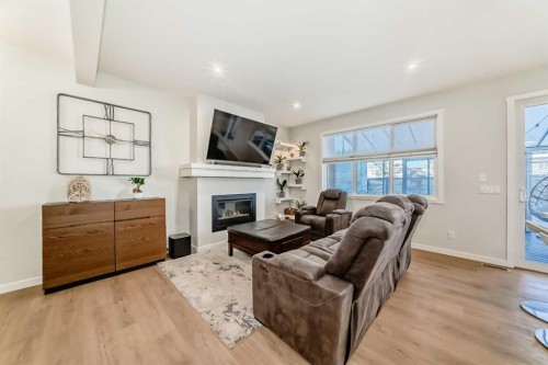 26 Lavender Drive Se, Calgary, AB - Indoor Photo Showing Living Room With Fireplace