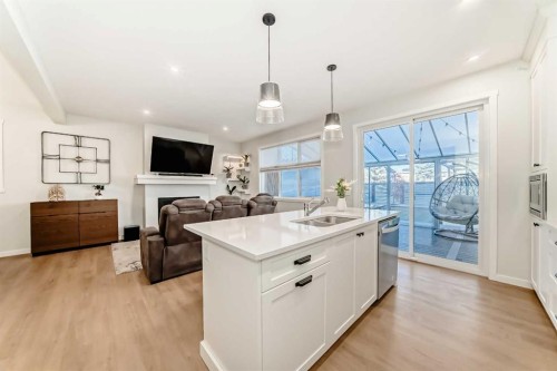 26 Lavender Drive Se, Calgary, AB - Indoor Photo Showing Kitchen With Fireplace With Double Sink