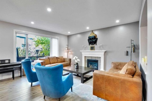 70 Royal Ridge Manor Nw, Calgary, AB - Indoor Photo Showing Living Room With Fireplace