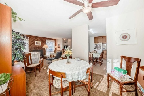 9 Maple Place, Strathmore, AB - Indoor Photo Showing Dining Room With Fireplace
