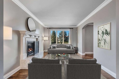 5512 Baroc Road Nw, Calgary, AB - Indoor Photo Showing Living Room With Fireplace