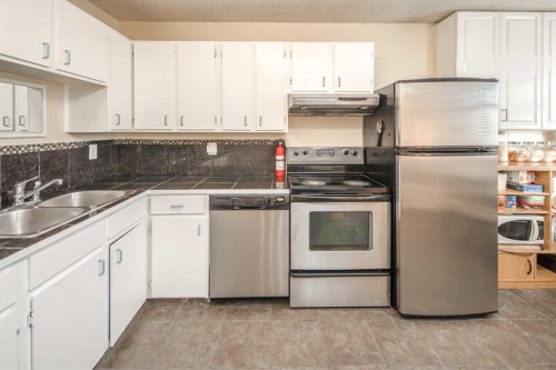 112 Shawmeadows Crescent Sw, Calgary, AB - Indoor Photo Showing Kitchen With Stainless Steel Kitchen With Double Sink