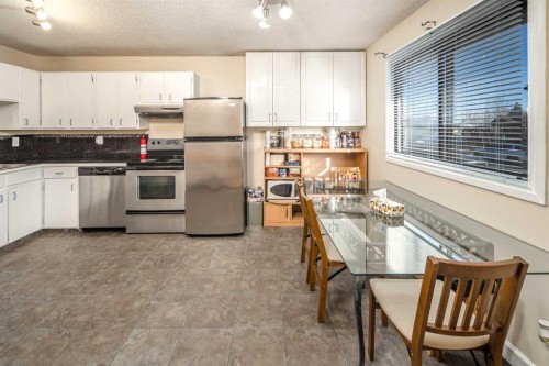 112 Shawmeadows Crescent Sw, Calgary, AB - Indoor Photo Showing Kitchen With Stainless Steel Kitchen