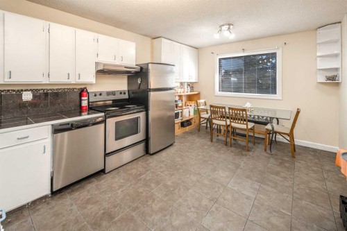 112 Shawmeadows Crescent Sw, Calgary, AB - Indoor Photo Showing Kitchen With Stainless Steel Kitchen