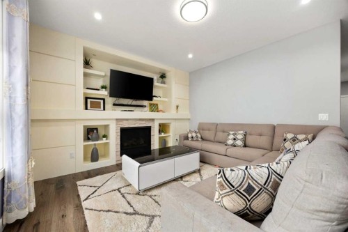 106 Baysprings Gardens Sw, Airdrie, AB - Indoor Photo Showing Living Room With Fireplace