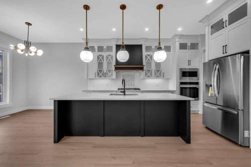 203 Kinniburgh Place, Chestermere, AB - Indoor Photo Showing Kitchen With Upgraded Kitchen
