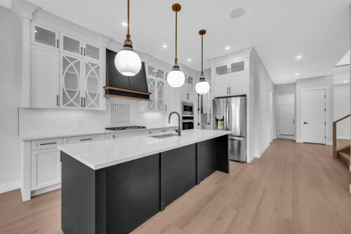 203 Kinniburgh Place, Chestermere, AB - Indoor Photo Showing Kitchen With Upgraded Kitchen