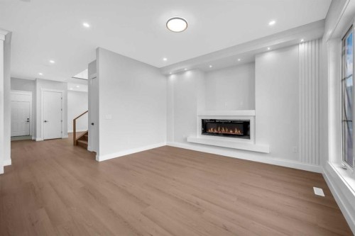 203 Kinniburgh Place, Chestermere, AB - Indoor With Fireplace