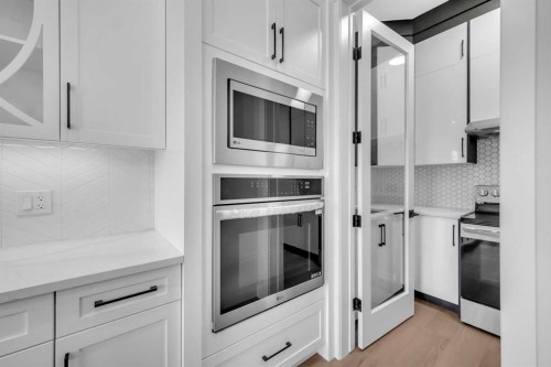 203 Kinniburgh Place, Chestermere, AB - Indoor Photo Showing Kitchen