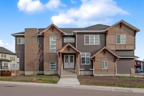 203 Kinniburgh Place, Chestermere, AB - Outdoor With Facade