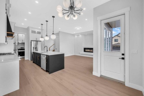 203 Kinniburgh Place, Chestermere, AB - Indoor Photo Showing Kitchen With Upgraded Kitchen