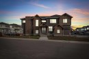 203 Kinniburgh Place, Chestermere, AB  - Outdoor With Facade 