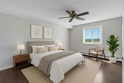 2107-7451 Springbank Boulevard Sw, Calgary, AB - Indoor Photo Showing Bedroom