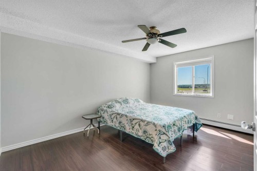 2107-7451 Springbank Boulevard Sw, Calgary, AB - Indoor Photo Showing Bedroom