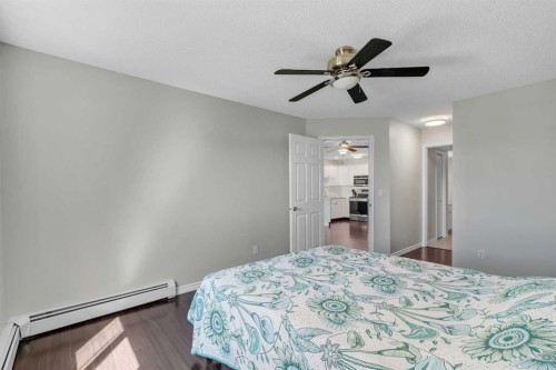 2107-7451 Springbank Boulevard Sw, Calgary, AB - Indoor Photo Showing Bedroom