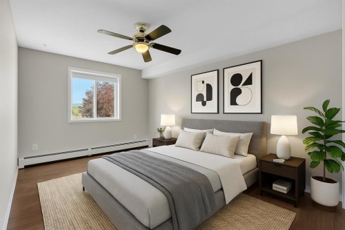 2107-7451 Springbank Boulevard Sw, Calgary, AB - Indoor Photo Showing Bedroom