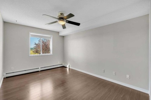 2107-7451 Springbank Boulevard Sw, Calgary, AB - Indoor Photo Showing Other Room