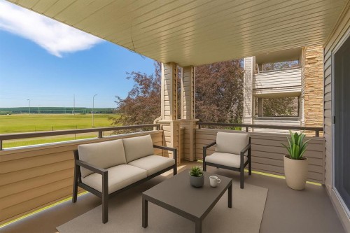 2107-7451 Springbank Boulevard Sw, Calgary, AB - Outdoor With Deck Patio Veranda With Exterior