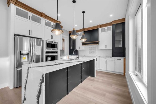 327 Kinniburgh Place, Chestermere, AB - Indoor Photo Showing Kitchen With Upgraded Kitchen