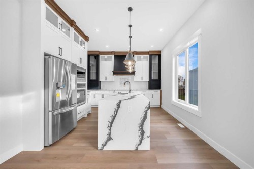327 Kinniburgh Place, Chestermere, AB - Indoor Photo Showing Kitchen With Upgraded Kitchen