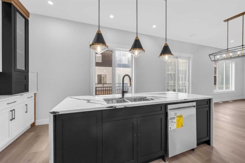 327 Kinniburgh Place, Chestermere, AB - Indoor Photo Showing Kitchen With Double Sink