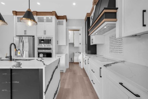 327 Kinniburgh Place, Chestermere, AB - Indoor Photo Showing Kitchen With Upgraded Kitchen