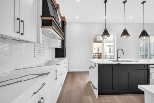 327 Kinniburgh Place, Chestermere, AB - Indoor Photo Showing Kitchen With Double Sink With Upgraded Kitchen