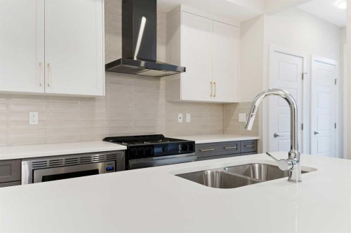 59 Agate Road, Cochrane, AB - Indoor Photo Showing Kitchen With Stainless Steel Kitchen With Double Sink With Upgraded Kitchen
