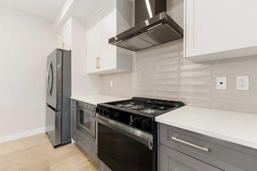 59 Agate Road, Cochrane, AB - Indoor Photo Showing Kitchen