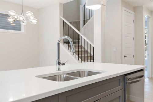 59 Agate Road, Cochrane, AB - Indoor Photo Showing Kitchen With Double Sink