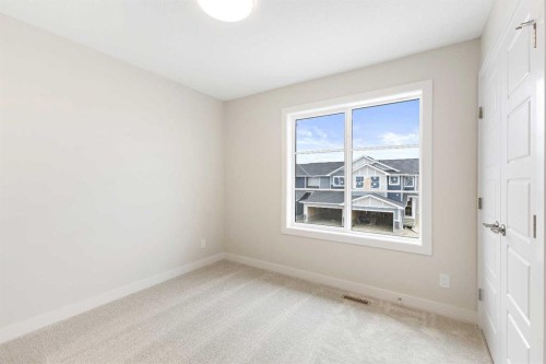 59 Agate Road, Cochrane, AB - Indoor Photo Showing Other Room